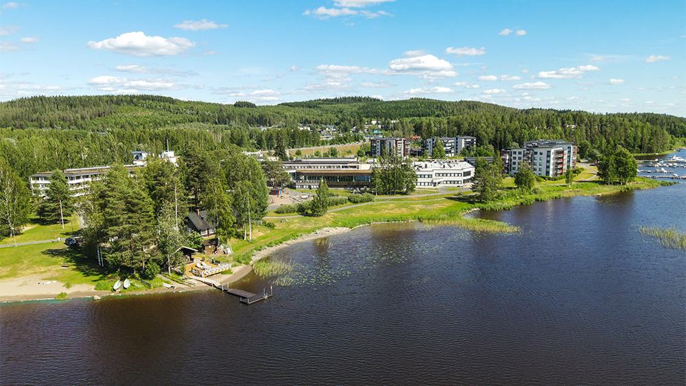 Aerial view of the lakeside spa hotel and forest shoreline of Lake Kallavesi near Kuopio