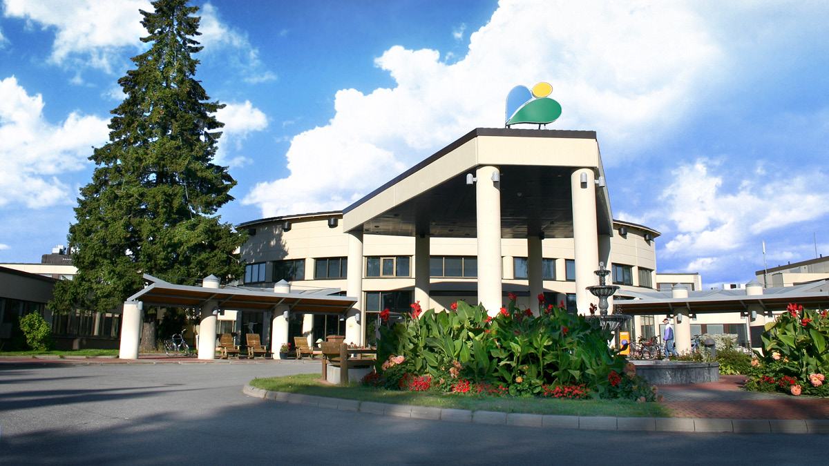 Exterior of Spa Hotel Kunnonpaikka surrounded by trees
