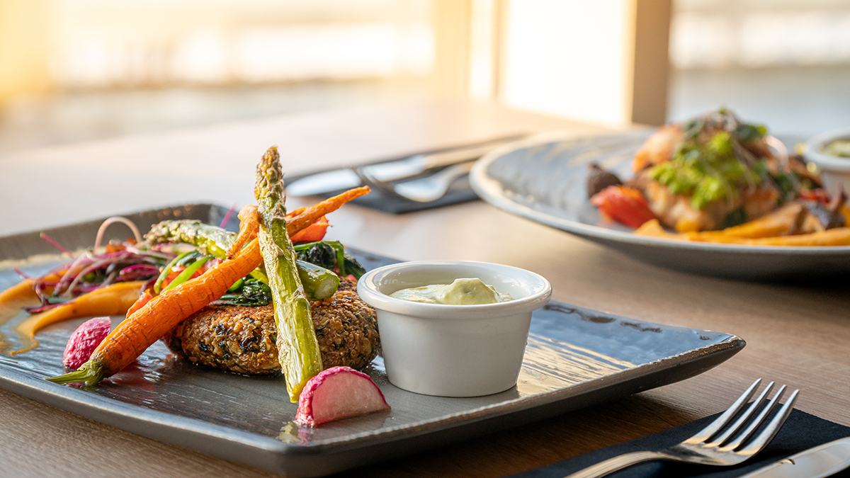 A plated dish of Finnish food made with local ingredients, served at a lakeside restaurant